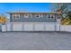 Storage building with three garage bays and pedestrian doors under a two-story structure at 5713 23Rd S Ave, Gulfport, FL 33707