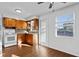 Cozy kitchen with wood cabinets, white appliances, and natural light from the window at 5713 23Rd S Ave, Gulfport, FL 33707