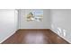 Bright living room features hardwood floors, window and fresh white paint at 5713 23Rd S Ave, Gulfport, FL 33707