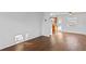 Bright living room with wood-look floors adjacent to the kitchen, creating an open and inviting space at 5713 23Rd S Ave, Gulfport, FL 33707