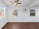 This living room boasts hardwood floors, fresh white paint and natural light at 5713 23Rd S Ave, Gulfport, FL 33707