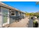 Outdoor deck features railing, a seating area with two stools, a table, and flowers at 5713 23Rd S Ave, Gulfport, FL 33707