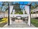 Outdoor pergola featuring comfortable seating and elegant draping, creating a relaxing space at 5713 23Rd S Ave, Gulfport, FL 33707