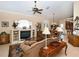 Spacious living room featuring a fireplace and mantle, with beautiful decor and natural lighting at 6276 Wingspan Way, Bradenton, FL 34203