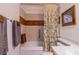 Bathroom with a shower over tub, towels, and a double granite vanity top at 663 Allegheny Dr, Sun City Center, FL 33573