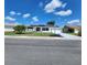 Beautifully landscaped single-story home with solar panels, a manicured lawn, and a lovely curb appeal at 663 Allegheny Dr, Sun City Center, FL 33573