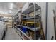 Spacious garage featuring sturdy shelving with organized storage solutions for tools and equipment at 663 Allegheny Dr, Sun City Center, FL 33573