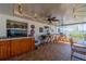 Covered patio with outdoor dining area and ceiling fans for comfortable outdoor living at 663 Allegheny Dr, Sun City Center, FL 33573