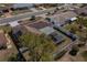 Aerial shot featuring a screened lanai and fenced-in yard, landscaped with green grass and shrubbery at 663 Allegheny Dr, Sun City Center, FL 33573