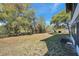 Large, grassy backyard surrounded by mature trees offers plenty of space at 6701 River Run Blvd, Weeki Wachee, FL 34607