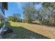 Spacious backyard with mature landscaping offers privacy and room to roam at 6701 River Run Blvd, Weeki Wachee, FL 34607