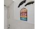 Bright bathroom featuring a modern shower and beach-themed decor at 6701 River Run Blvd, Weeki Wachee, FL 34607