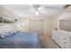 Cozy bedroom with a ceiling fan and a dresser offers a serene retreat for rest and relaxation at 6701 River Run Blvd, Weeki Wachee, FL 34607