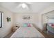 Cozy bedroom with a comfy bed, seaside decor, and closet with mirrored doors at 6701 River Run Blvd, Weeki Wachee, FL 34607