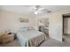 Bright bedroom with a ceiling fan, comfortable decor, and a mirrored closet for added space at 6701 River Run Blvd, Weeki Wachee, FL 34607