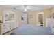 Well-lit bedroom with ensuite bathroom access, showcasing a comfortable and accessible layout at 6701 River Run Blvd, Weeki Wachee, FL 34607