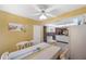 Sunlit dining area with a table, adjacent to a white kitchen at 6701 River Run Blvd, Weeki Wachee, FL 34607