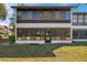 Two-story condo unit with floor to ceiling windows at 6701 River Run Blvd, Weeki Wachee, FL 34607