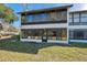 Two story condo featuring screened in patio and lawn at 6701 River Run Blvd, Weeki Wachee, FL 34607