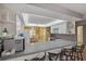Open kitchen with breakfast bar and white cabinets, conveniently located near dining area at 6701 River Run Blvd, Weeki Wachee, FL 34607