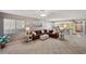 Open-concept living room features a comfortable seating area and seamless flow to the kitchen and entry at 6701 River Run Blvd, Weeki Wachee, FL 34607