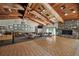 Open lounge area with fireplace and beautiful vaulted wooden ceilings at 6701 River Run Blvd, Weeki Wachee, FL 34607