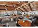 Spacious lounge area with high wood ceilings, ceiling fans, and furniture at 6701 River Run Blvd, Weeki Wachee, FL 34607