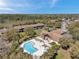 Aerial view of community pool, spa and clubhouse at Ocala Sun RV Resort at 6701 River Run Blvd, Weeki Wachee, FL 34607