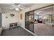 Cozy sunroom offers backyard views and connects to the living room through sliding glass doors at 6701 River Run Blvd, Weeki Wachee, FL 34607