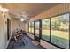 Enclosed porch with ceiling fan and outdoor view; great for relaxing and entertaining at 6701 River Run Blvd, Weeki Wachee, FL 34607