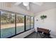 Sunroom with sliding windows provides a great view of the backyard landscape at 6701 River Run Blvd, Weeki Wachee, FL 34607