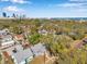 Bird's eye view of neighborhood featuring charming homes, tree-lined streets, and a vibrant cityscape in the distance at 689 Paris S Ave, St Petersburg, FL 33701