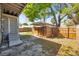 View of the backyard featuring a wooden privacy fence, and a covered area perfect for outdoor entertaining at 689 Paris S Ave, St Petersburg, FL 33701