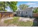 Spacious backyard with lush greenery, fenced for privacy, and offering outdoor living at 689 Paris S Ave, St Petersburg, FL 33701