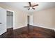 Bright, spacious bedroom featuring original wood floors, ceiling fan and ample closet space at 689 Paris S Ave, St Petersburg, FL 33701