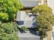 An aerial view of a home with mature trees surrounding the property at 710 E Plymouth St, Tampa, FL 33603