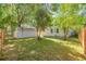 Expansive backyard with a detached shed and wooden fence providing privacy at 710 E Plymouth St, Tampa, FL 33603
