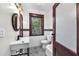 Stylishly updated bathroom with vessel sink, black fixtures, and decorative tiled floor at 710 E Plymouth St, Tampa, FL 33603
