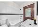Bright bathroom featuring modern fixtures, tiled walls, and a decorative tiled floor at 710 E Plymouth St, Tampa, FL 33603