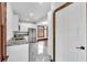 Updated kitchen with stainless steel appliances, marble countertops and flooring, and bright lighting at 710 E Plymouth St, Tampa, FL 33603