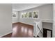 Bright living room with hardwood floors, staircase, and many windows at 710 E Plymouth St, Tampa, FL 33603