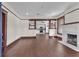 Open-concept living room with dark hardwood floors, white walls, and dark trim at 710 E Plymouth St, Tampa, FL 33603