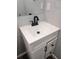 Bathroom vanity with a white cabinet, quartz countertop, and stylish fixtures at 710 Seminole, Clearwater, FL 33755