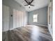 Bright bedroom with hardwood floors, ceiling fan, closet, and natural light at 710 Seminole, Clearwater, FL 33755