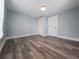 Bedroom featuring hard surface flooring, fresh paint, a large closet, and a window at 710 Seminole, Clearwater, FL 33755