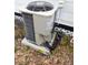 Exterior shot of the home's HVAC unit, sitting on a concrete pad with green foliage surrounding it at 710 Seminole, Clearwater, FL 33755