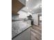 Updated kitchen featuring white cabinets, granite countertops, and stainless steel appliances at 710 Seminole, Clearwater, FL 33755