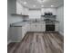 Well-lit kitchen features stainless steel appliances, granite countertops, and ample cabinet space at 710 Seminole, Clearwater, FL 33755