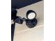 Close up of an exterior adjustable lighting fixture for security and ambiance at 710 Seminole, Clearwater, FL 33755