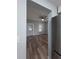View of the living room, featuring new wood flooring, a modern ceiling fan, and soft blue walls at 710 Seminole, Clearwater, FL 33755